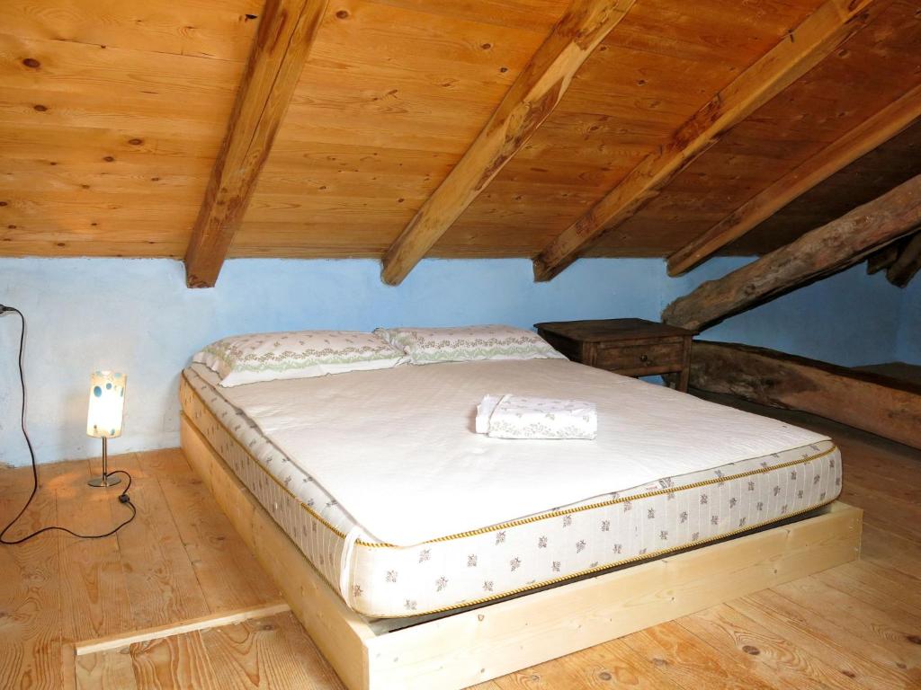 Łóżko lub łóżka w pokoju w obiekcie Holiday Home Casetta by Interhome
