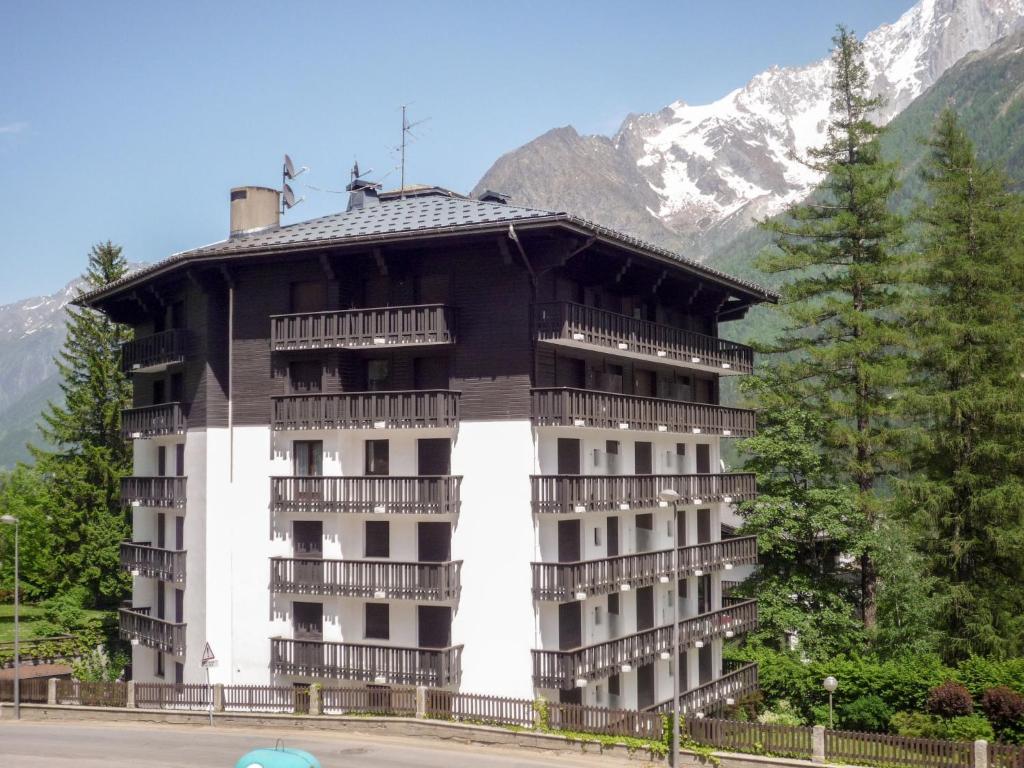 a large building in front of a mountain at Apartment Les Aiguilles du Brévent by Interhome in Chamonix