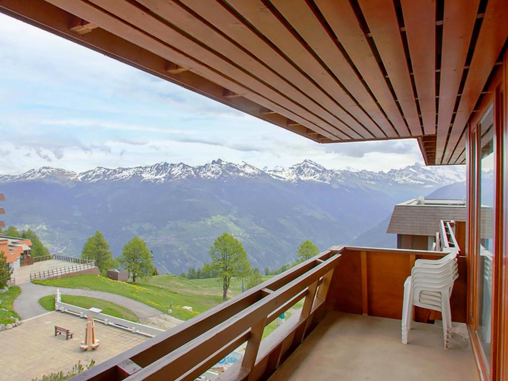 a balcony with a view of mountains at Apartment Arzinol 402 by Interhome in Les Collons