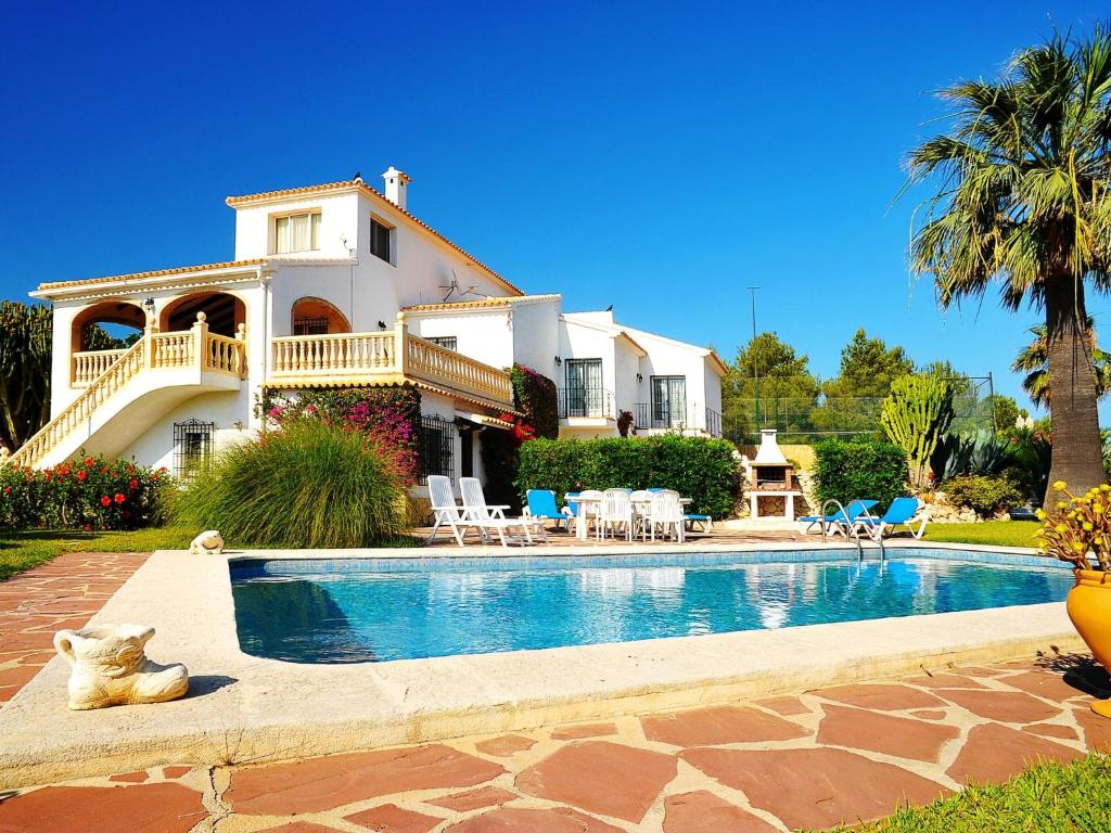 a house with a swimming pool in front of a house at Holiday Home Portichol by Interhome in Balcon del Mar