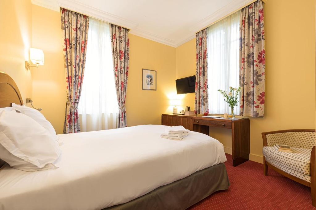 Postel nebo postele na pokoji v ubytování Hôtel Spa Thermalia