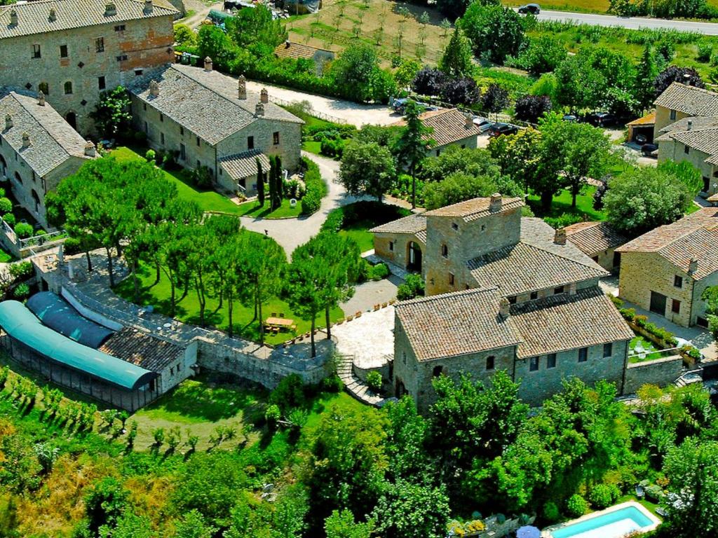 an aerial view of a house with a water park at Villa Borgo Monticelli-2 by Interhome in Castiglione della Valle