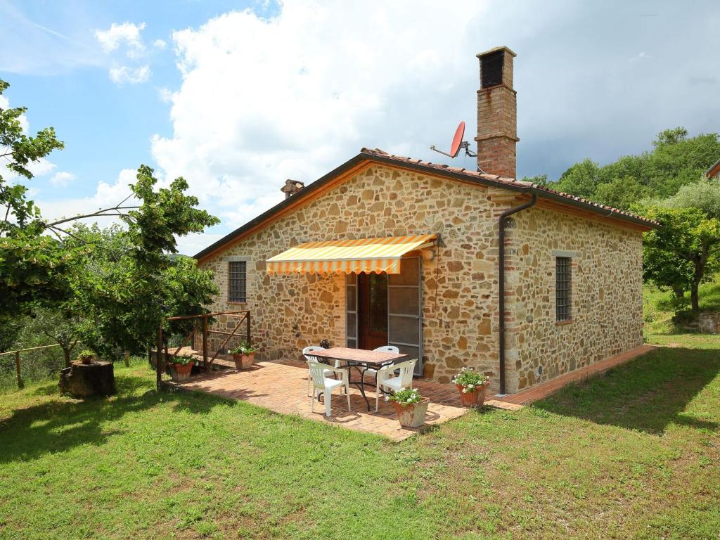 a stone house with a picnic table in front of it at Holiday Home Ca' di Bacco-1 by Interhome in Nestore