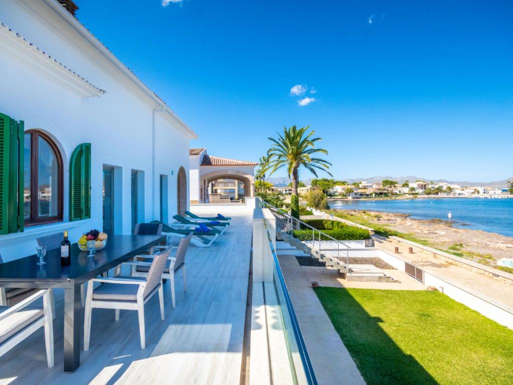 a balcony of a house with a view of the water at Villa Can Verd by Interhome in Alcudia
