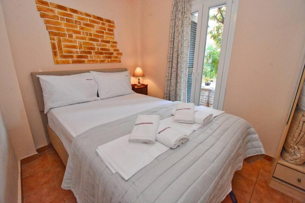 Postel nebo postele na pokoji v ubytování Kampielos Homes