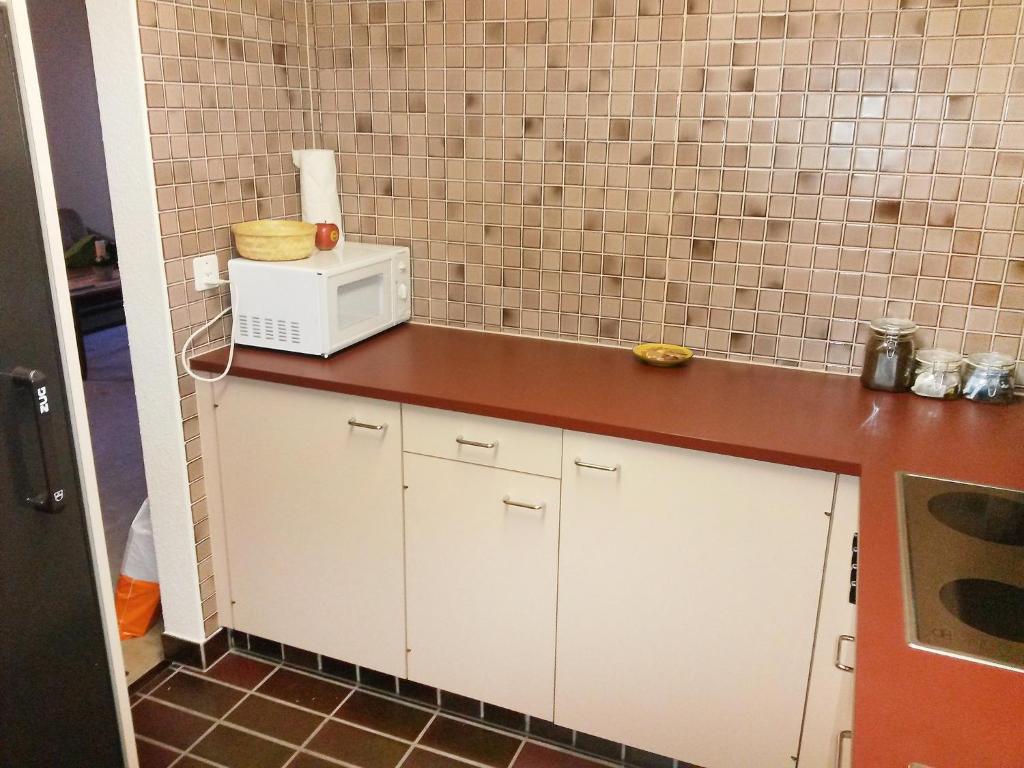 Kuchyň nebo kuchyňský kout v ubytování Apartment Apartment 10 by Interhome