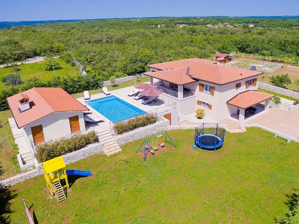 an aerial view of a house with a swimming pool at Villa Lucija by Interhome in Raša