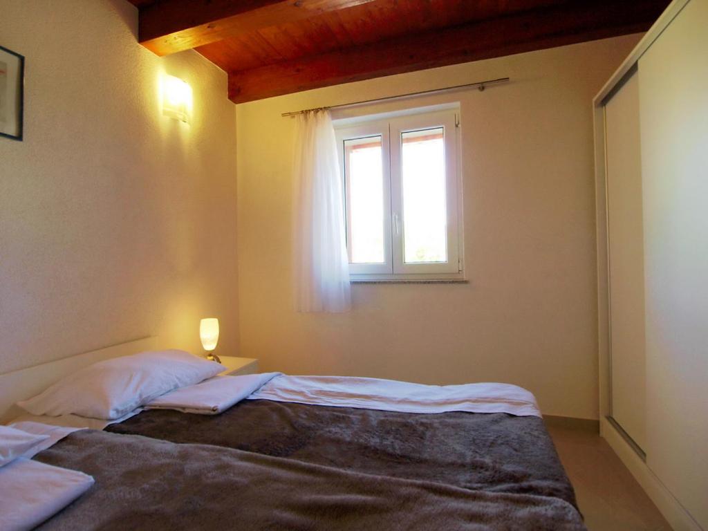Łóżko lub łóżka w pokoju w obiekcie Holiday Home Villa Sandra by Interhome