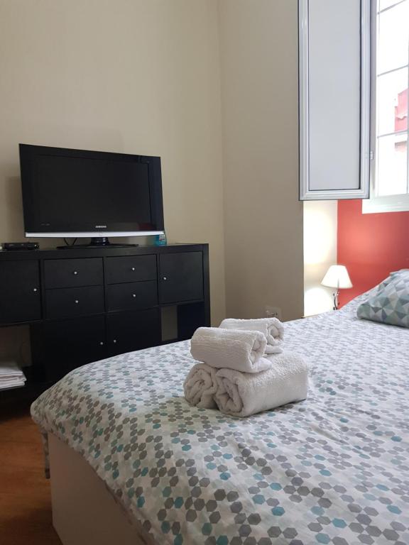 Posteľ alebo postele v izbe v ubytovaní Magnifico Apartamento tipo Dúplex en Triana