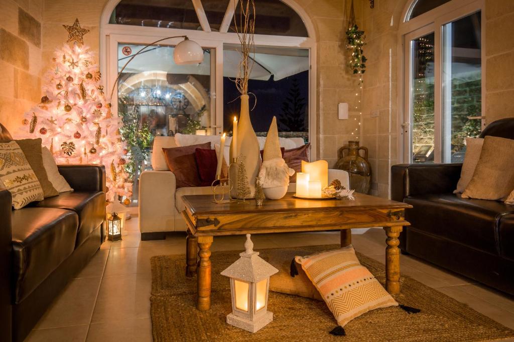 a living room filled with furniture and decorations at Sweet Life Gozo in Santa Luċija