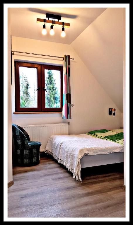 Postel nebo postele na pokoji v ubytování Leśne Berdo 4