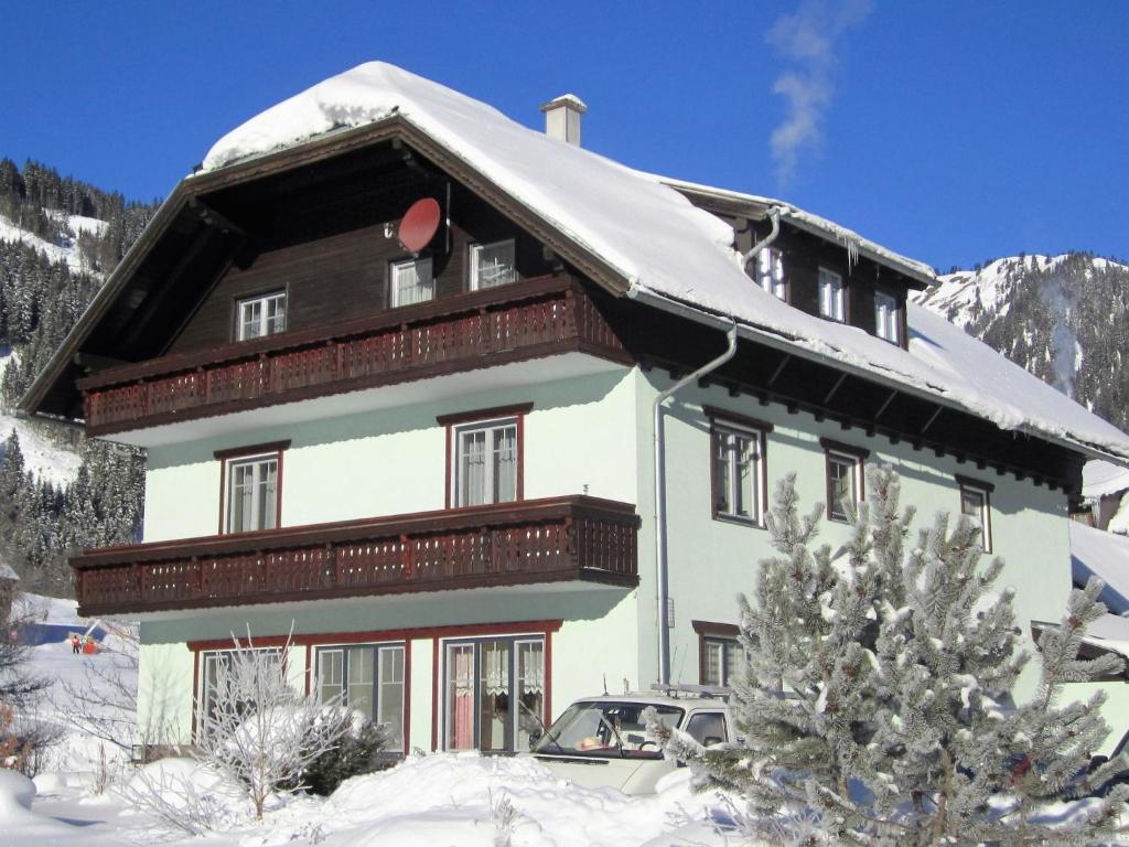 a large building with snow on top of it at Studio Dirndl und Bua by Interhome in Donnersbachwald