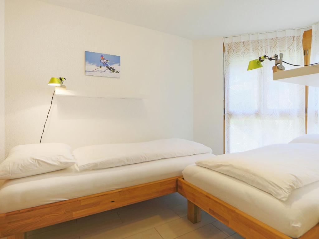 Postel nebo postele na pokoji v ubytování Apartment Susanna by Interhome