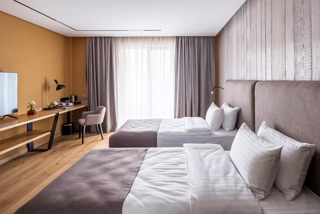 Postel nebo postele na pokoji v ubytování Loft7