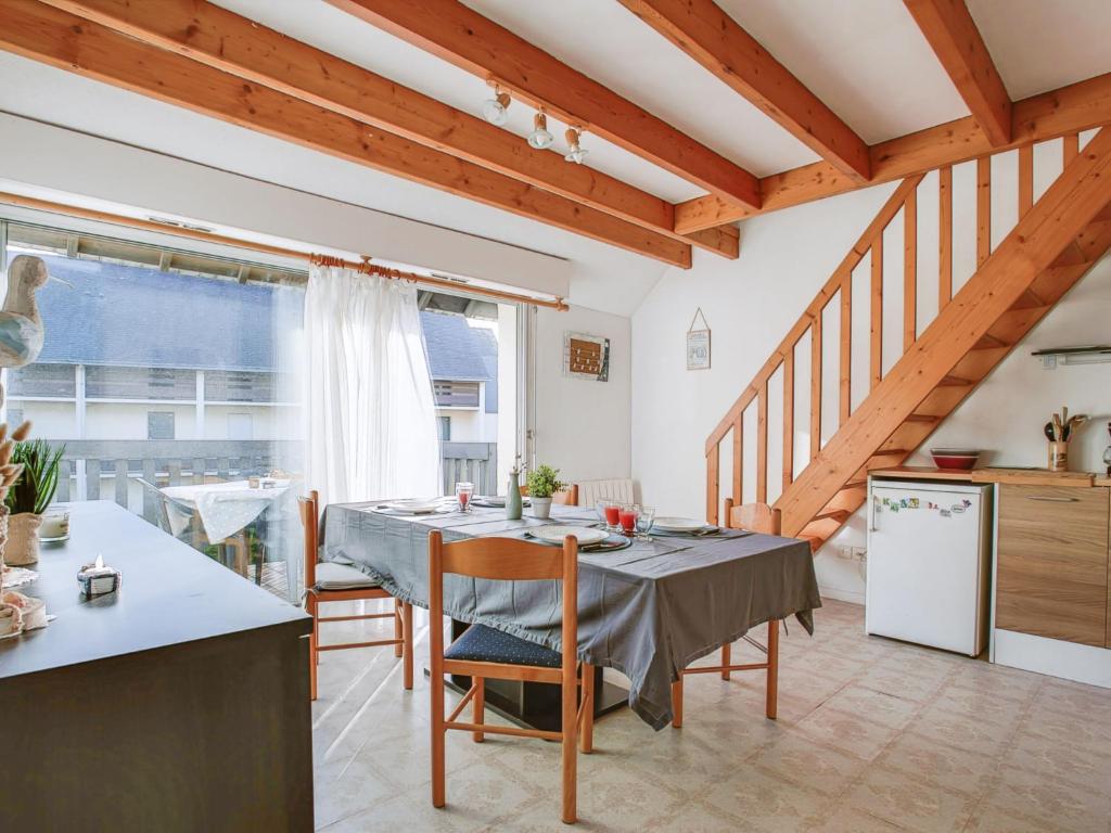 a kitchen and dining room with a table and chairs at Apartment Mer et Plages-3 by Interhome in Carnac-Plage