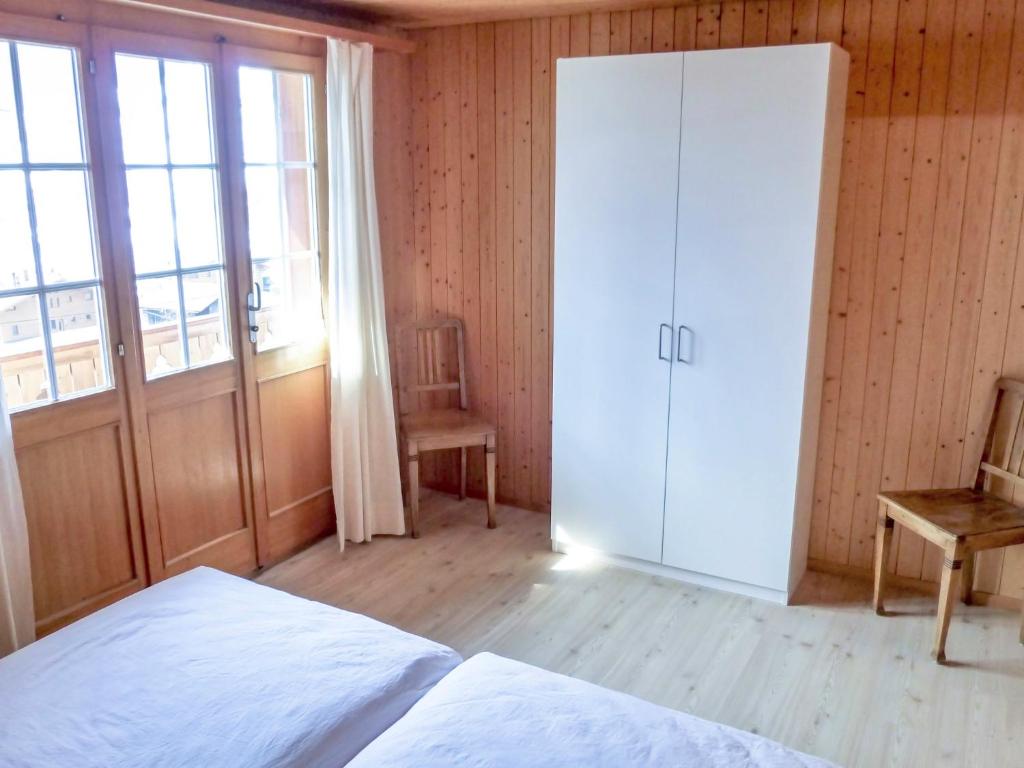 Postel nebo postele na pokoji v ubytování Holiday Home Chalet Reinhysi by Interhome
