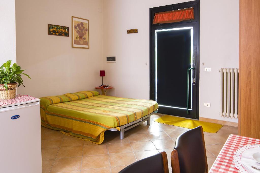 A bed or beds in a room at Affittacamere Donati Nada