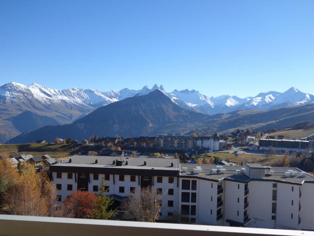 a city with snow capped mountains in the background at Apartment Champ Bozon by Interhome in La Toussuire