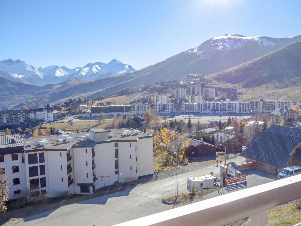 a view of a city with mountains in the background at Apartment Champ Bozon by Interhome in La Toussuire