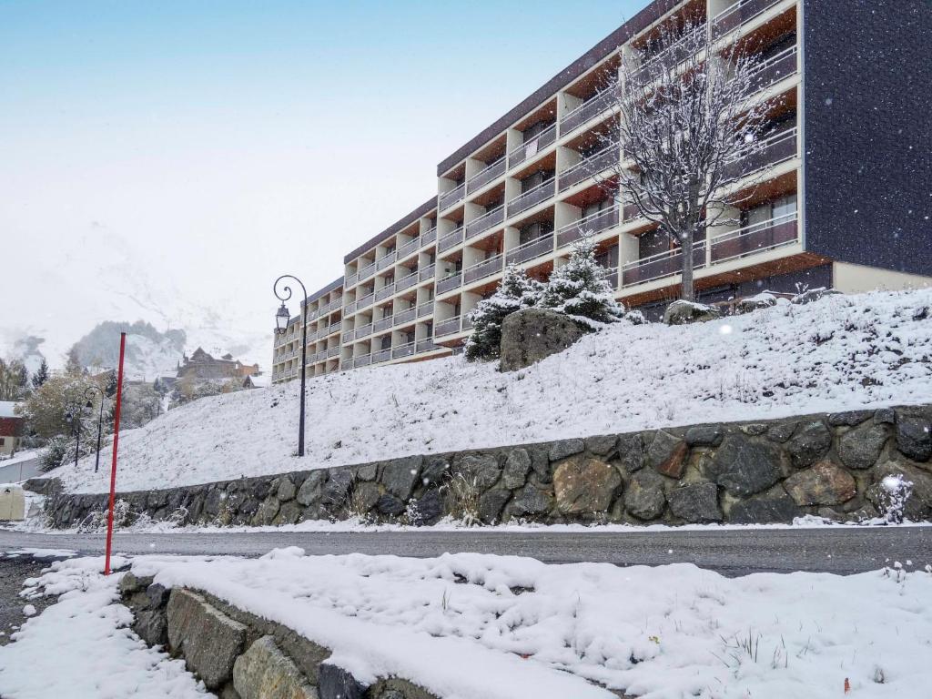 a building with snow on the side of a street at Apartment Champ Bozon by Interhome in La Toussuire