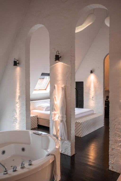 Postel nebo postele na pokoji v ubytování B&B Suites FEEK