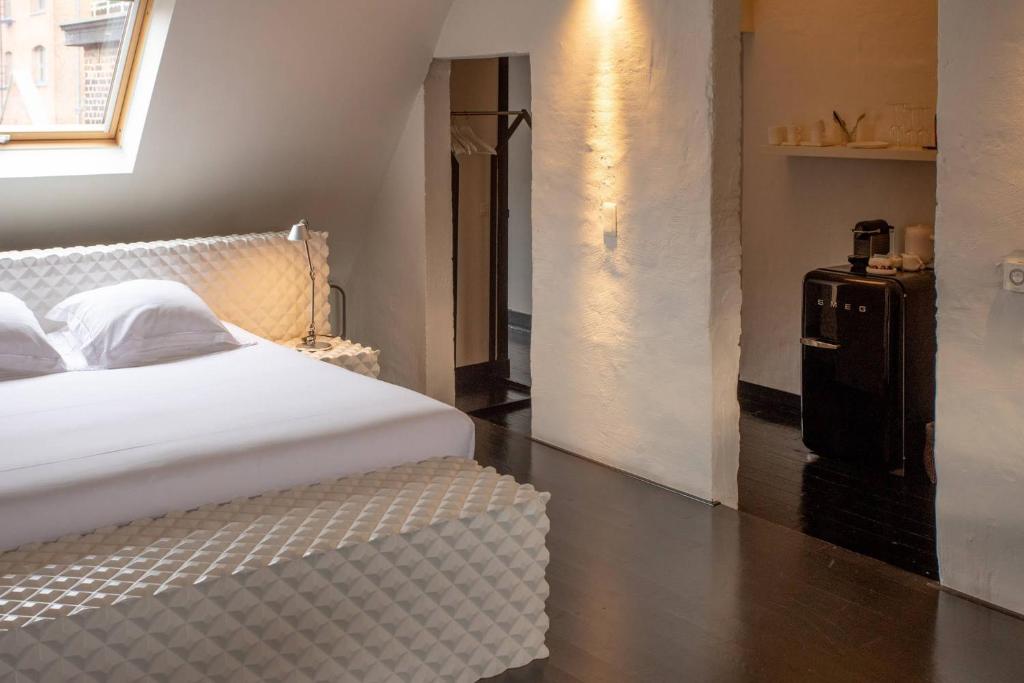 Postel nebo postele na pokoji v ubytování B&B Suites FEEK