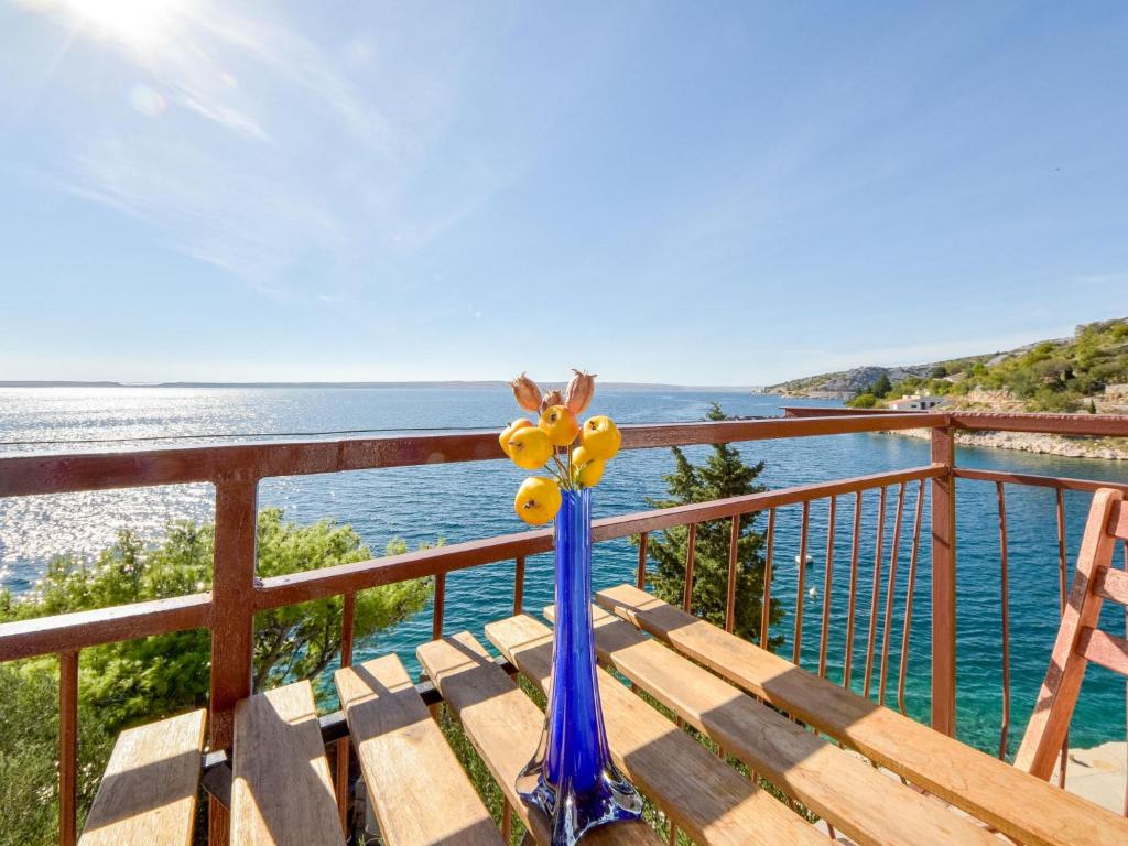 a blue vase sitting on a table on a balcony at Apartment Vukić-1 by Interhome in Tribanj-Krušćica