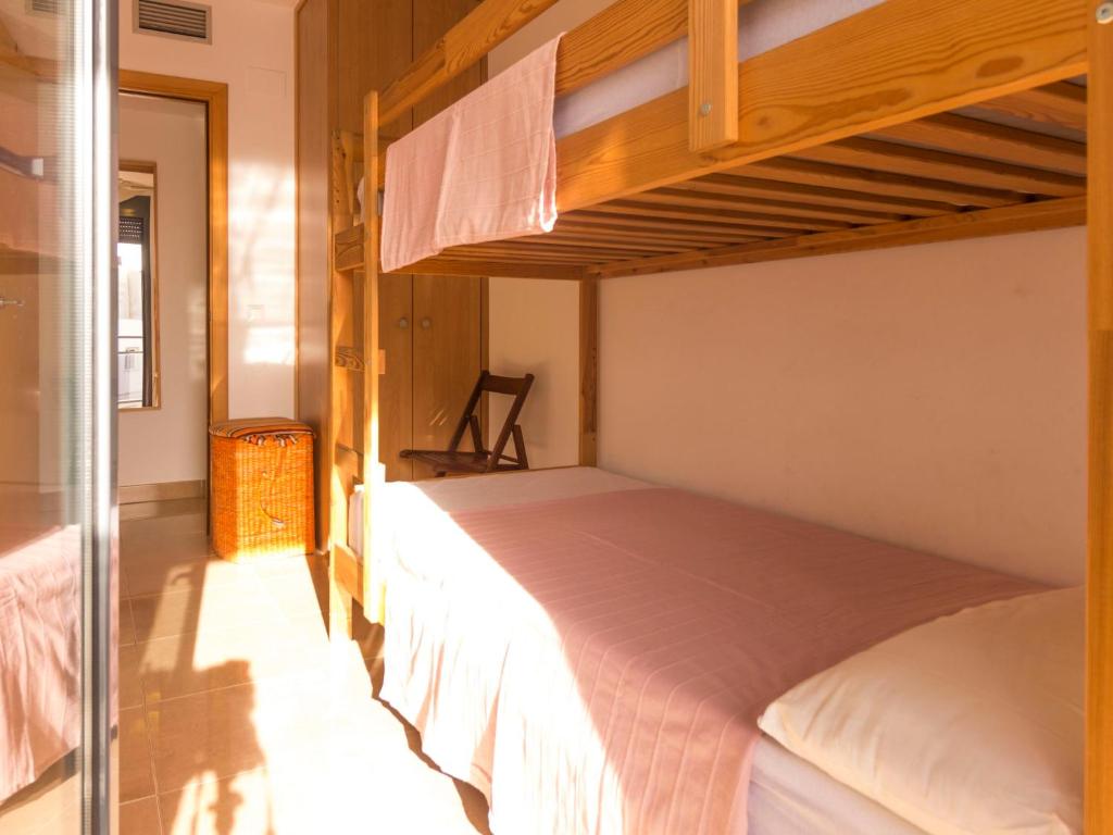 A bed or beds in a room at Apartment Goleta-2 by Interhome