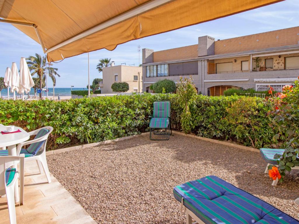 A garden outside Apartment Golf Sant Jordi by Interhome