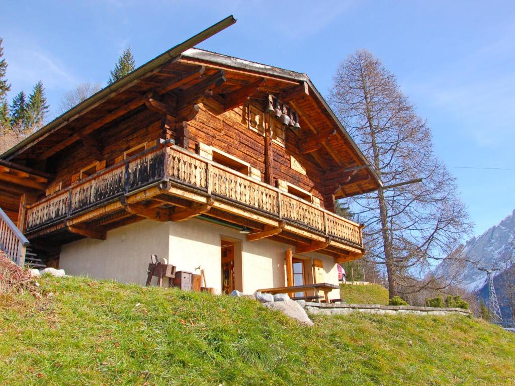 a building with a balcony on top of a hill at Chalet Jodeli by Interhome in Gryon