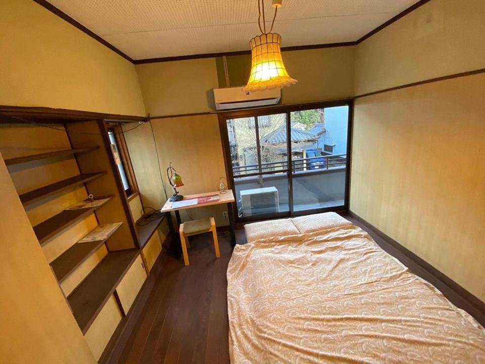 Postel nebo postele na pokoji v ubytování あまね庵 Villa Amane