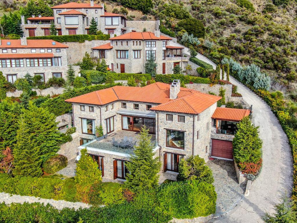 an aerial view of a house with an orange roof at Winterfell Estate in Arachova