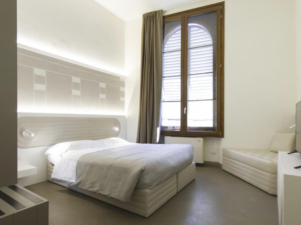 A bed or beds in a room at Apartment Tipologia Trilo 05 pax by Interhome