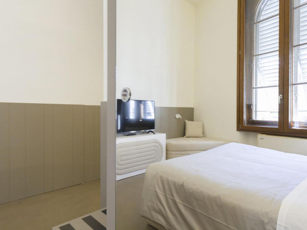 A bed or beds in a room at Apartment Tipologia Trilo 05 pax by Interhome