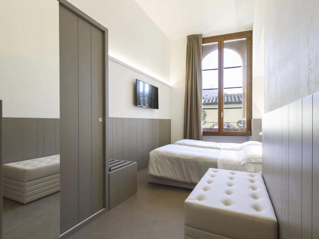 A bed or beds in a room at Apartment Tipologia Trilo 05 pax by Interhome