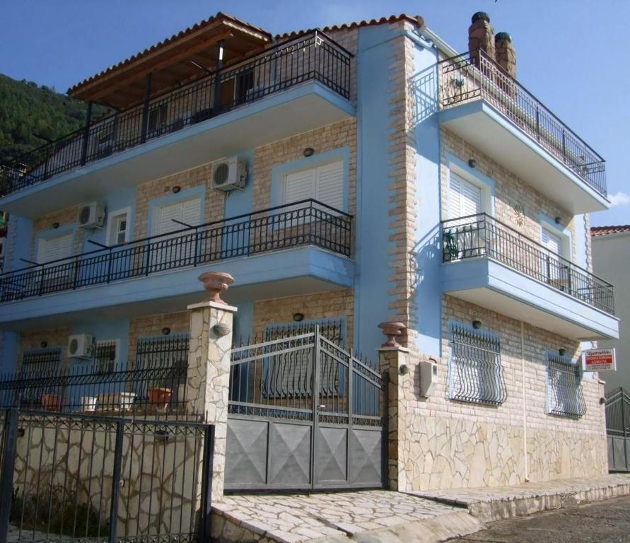 a house with balconies on the side of it at Kristallia Rooms in Monastiraki