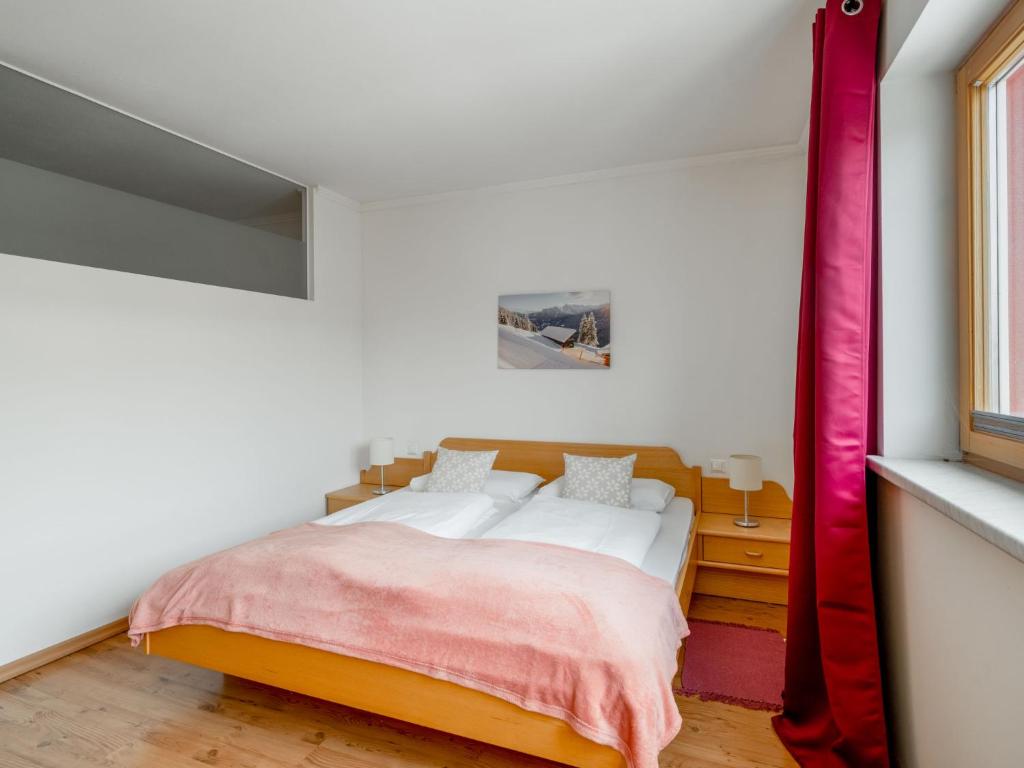 A bed or beds in a room at Apartment Appartement 3 by Interhome