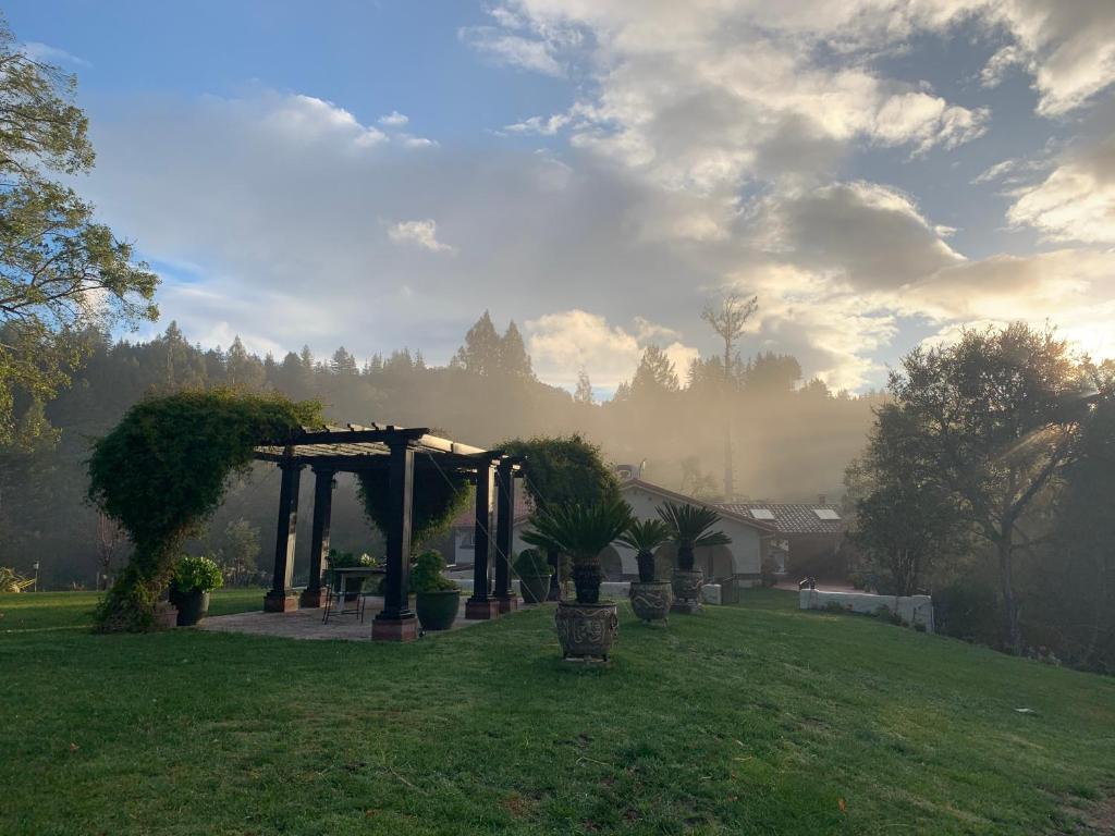 a garden with a gazebo in a field at Mountain Lodge Estate in Los Gatos