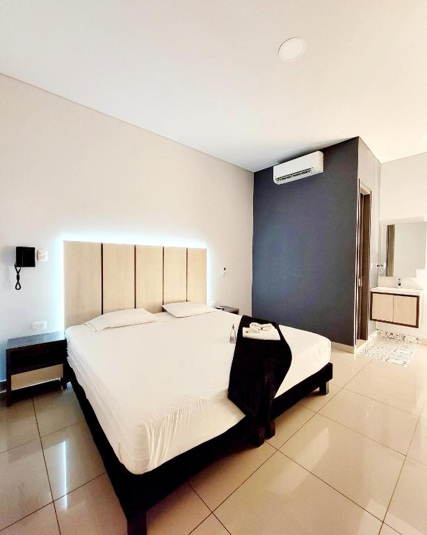 Letto o letti in una camera di HOTEL NABU VALLEDUPAR