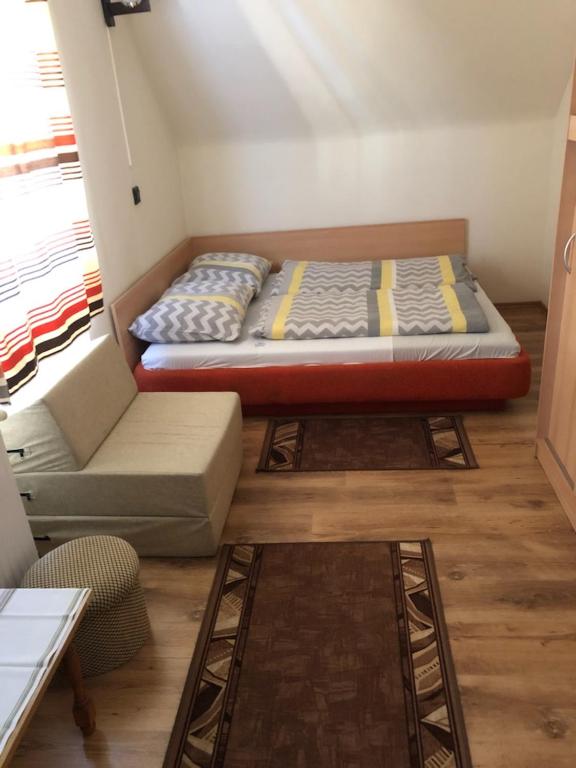 Postel nebo postele na pokoji v ubytování Ádám Vendégház