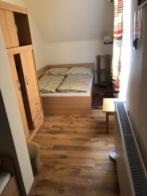 Postel nebo postele na pokoji v ubytování Ádám Vendégház