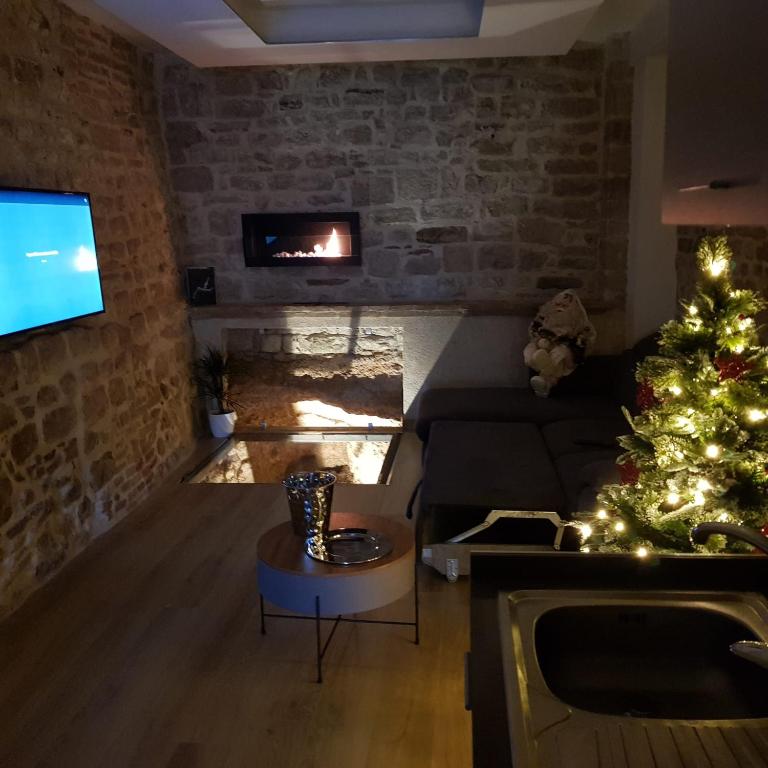 Telewizja i/lub zestaw kina domowego w obiekcie Appartamento Gattapone 9