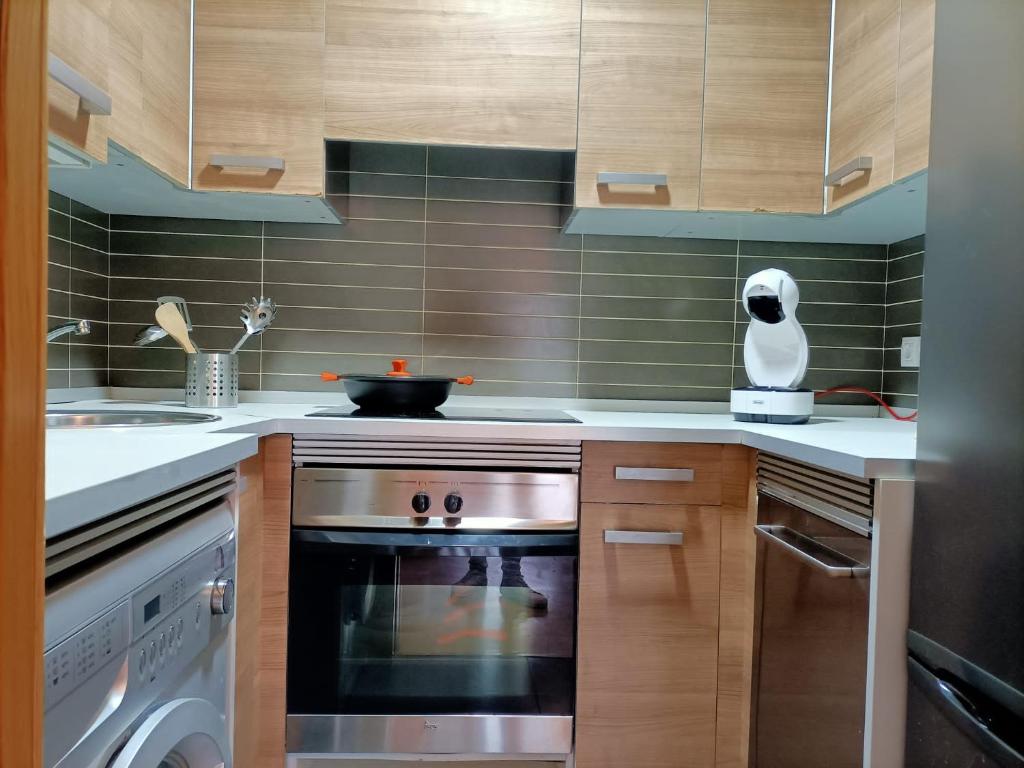 Kuchyň nebo kuchyňský kout v ubytování Relájate en Ramales de la Victoria, apartamento con piscina y parking