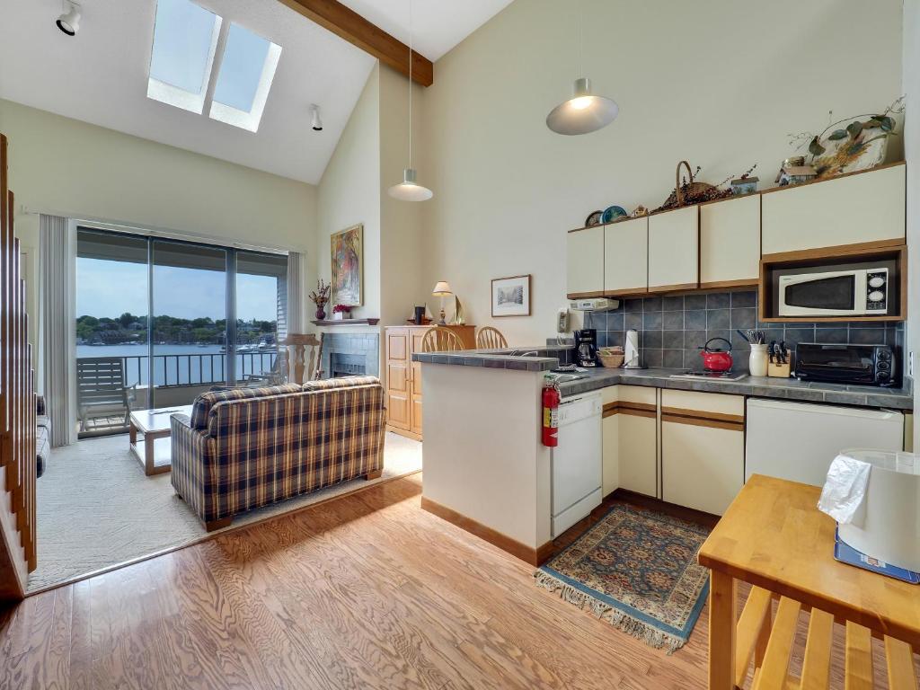 a kitchen and living room with a counter top at 349 Edgewater Inn in Charlevoix