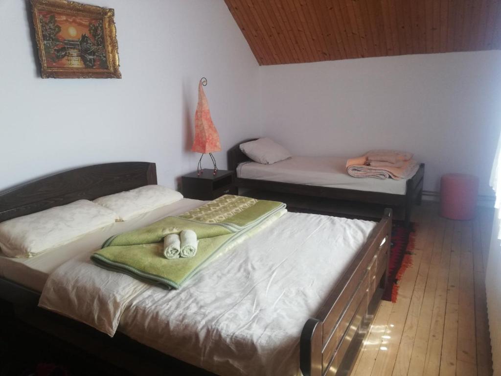 a bedroom with two beds with towels on them at Domaćinstvo Sindžirević in Nova Varoš