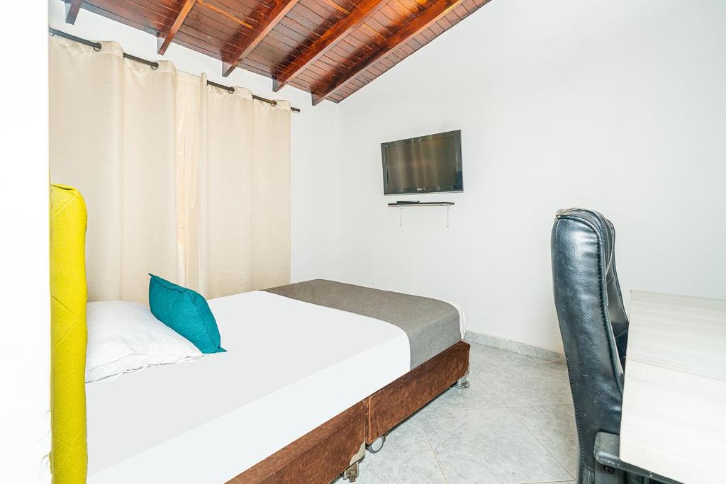 Postel nebo postele na pokoji v ubytování Ayenda Casa San Pablo