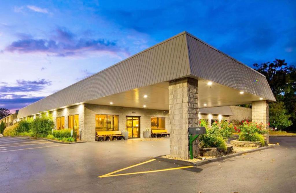 a large building with a parking lot in front of it at Best Western Branson Inn and Conference Center in Branson