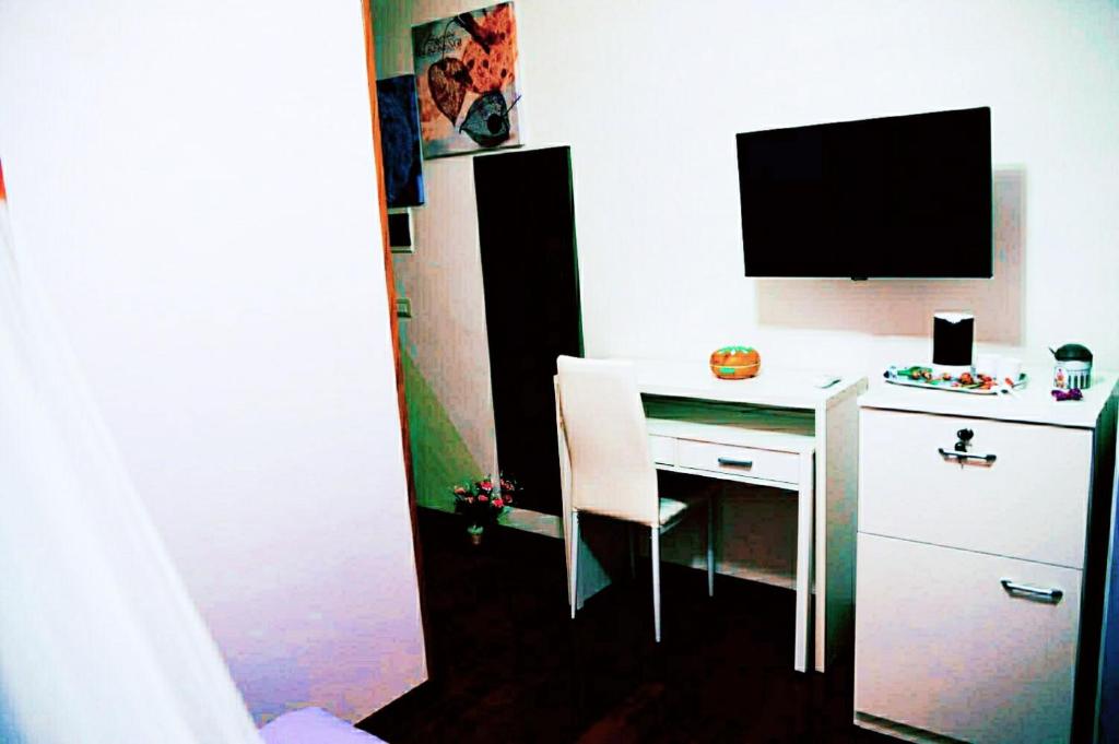 Telewizja i/lub zestaw kina domowego w obiekcie Altea Royale