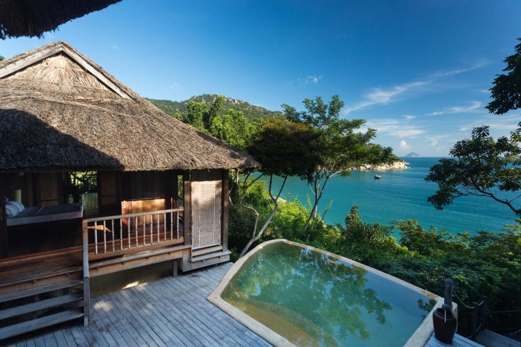 a villa with a plunge pool and a view of the ocean at Six Senses Ninh Van Bay in Ninh Van Bay