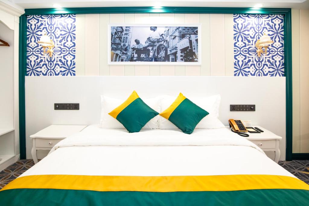 Postel nebo postele na pokoji v ubytování Fu Hua Hotel